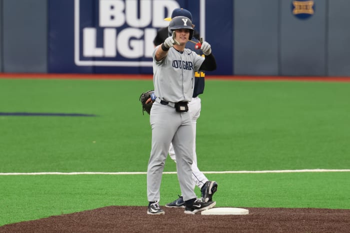 BYU first baseman Cooper Vest points to the Cougars dugout after delivering a double in the fourth inning.